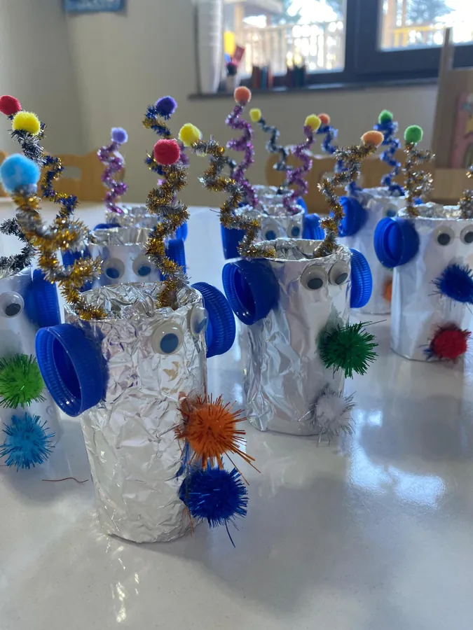 Robot figures made from cardboard tubes and foil