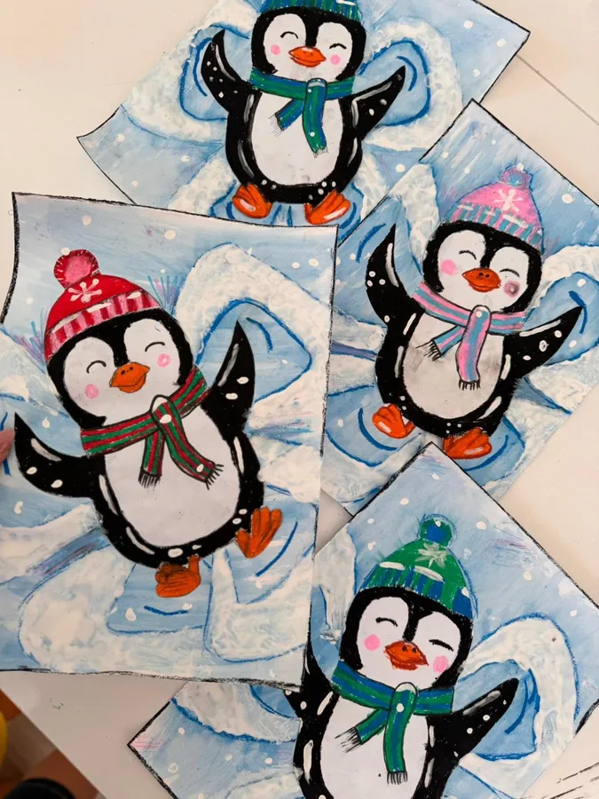 Pictures of penguins making snow angels
