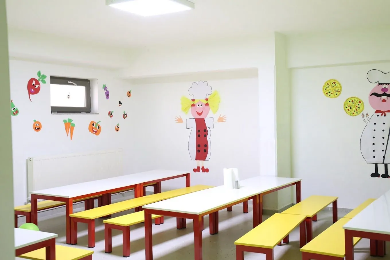 The dining room: child-sized tables and benches